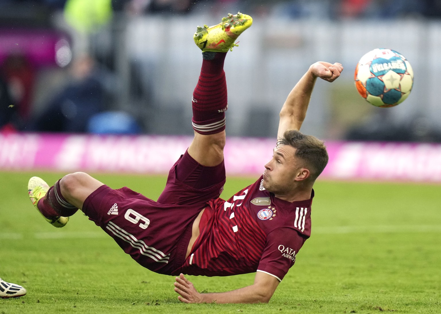 FILE - Bayern&#039;s Joshua Kimmich kicks the ball during the German Bundesliga soccer match between FC Bayern Munich and SC Freiburg in Munich, Germany, Nov. 6, 2021. Bayern Munich player Joshua Kimm ...