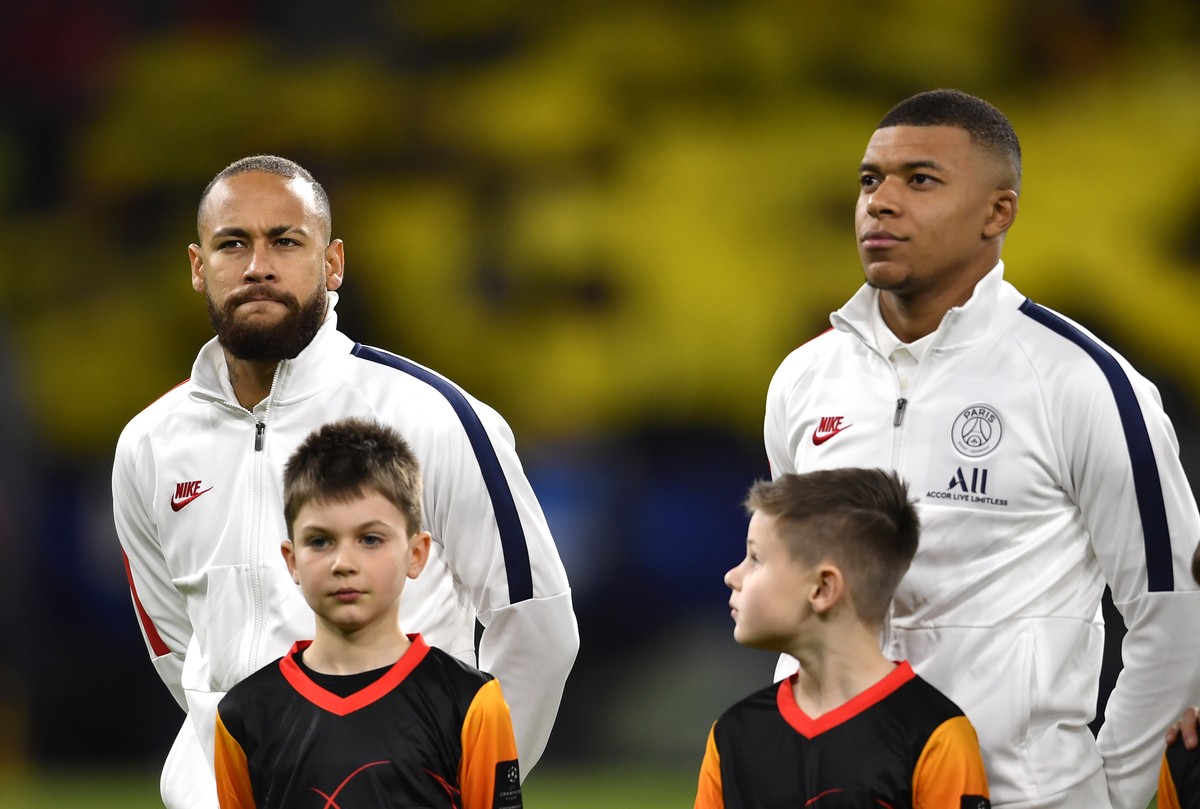 PSG's Neymar, left, and PSG's Kylian Mbappe prior the Champions League round of 16 first leg soccer match between Borussia Dortmund and Paris Saint Germain in Dortmund, Germany, Tuesday, Feb ...