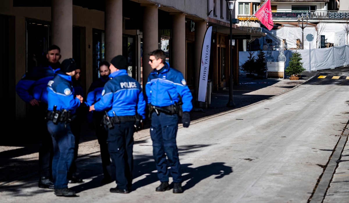 Police officers inspect the area where a fire broke out at the Le Constellation bar and lounge leaving people dead and injured, during New Years celebration, in Crans-Montana, Swiss Alps, Switzerland ...