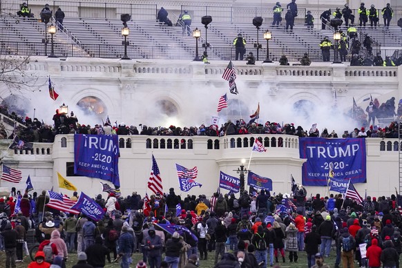 FILE - Rioters, loyal to President Donald Trump, storm the Capitol, Wednesday, Jan. 6, 2021, in Washington. Former President Donald Trump said during a debate with President Joe Biden last week that t ...
