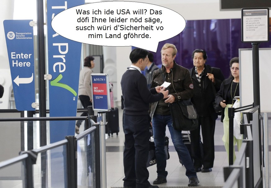 Travelers at John F. Kennedy International Airport are checked in by a Transportation Security Administration employee, left, at a TSA Pre line, Thursday, Oct. 30, 2014 in New York. TSA Pre is an expe ...
