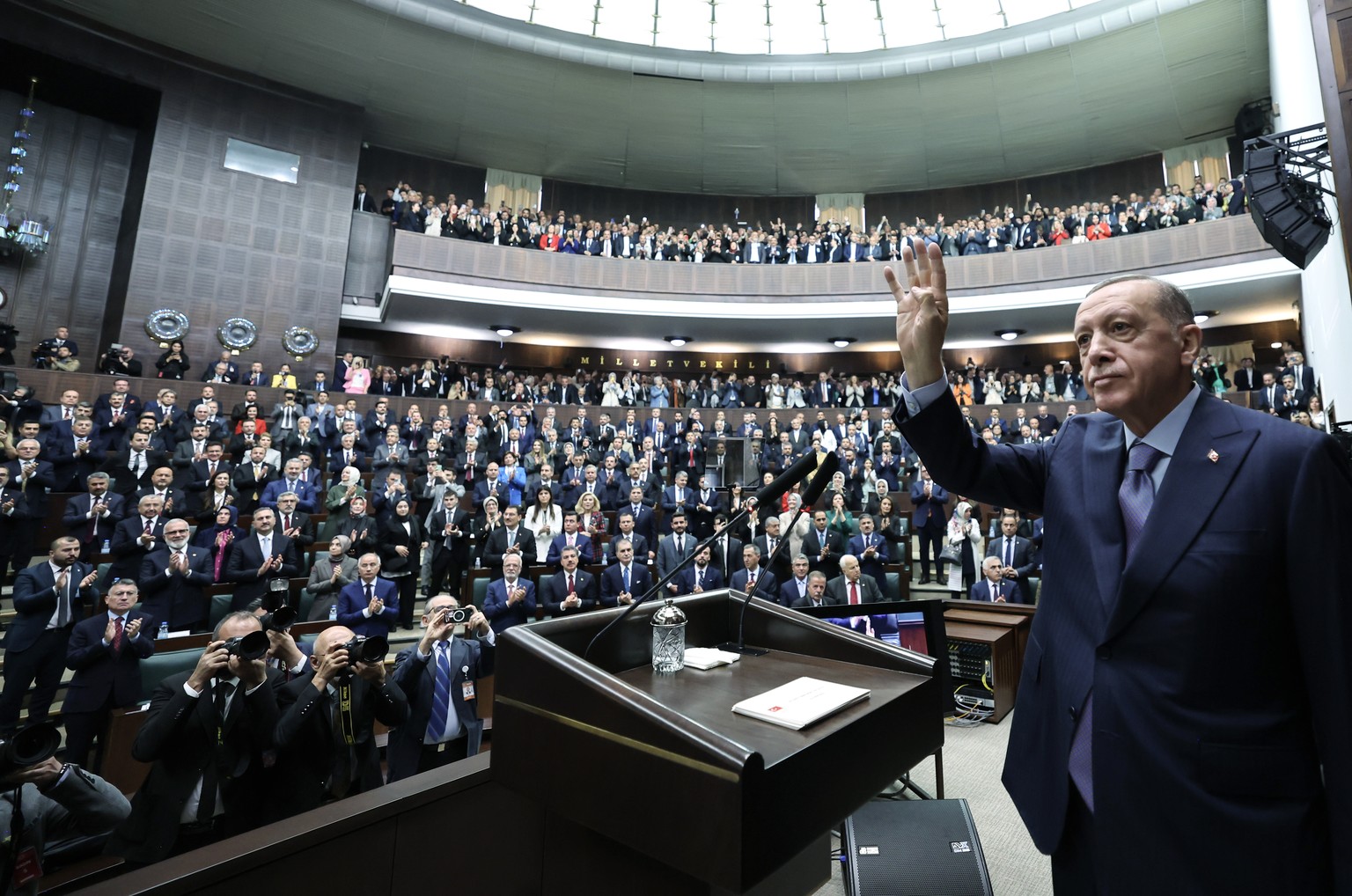 epa10938336 A handout photo made available by the Turkish President Press Office shows Turkish President Recep Tayyip Erdogan waving as he addresses members of ruling Justice and Development Party (AK ...