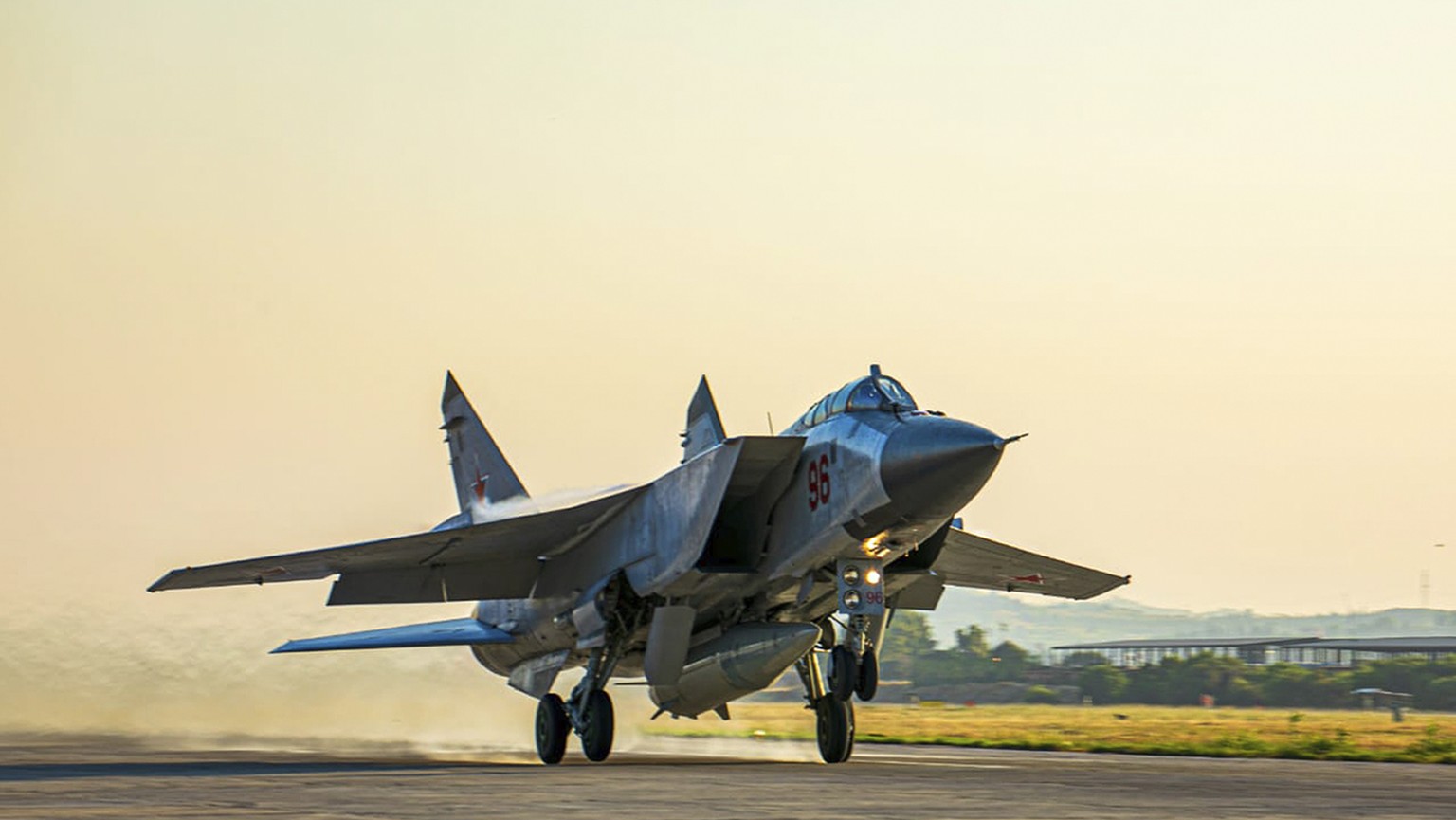 FILE - In this photo released by the press service of the Russian Ministry of Defense, a Russian MiG-31 fighter jet carrying a Kinzhal missile takes off from Hemeimeem Air Base in Syria on June 25, 2021.  The Ru...