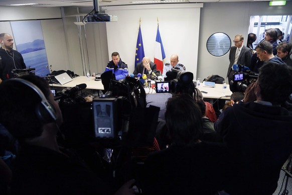 epa04679843 French prosecutor of Marseille Brice Robin (C), flanked by General David Galtier (R), holds a press conference at the Marseille Provence airport in Marignane, near Marseille, France, 26 Ma ...