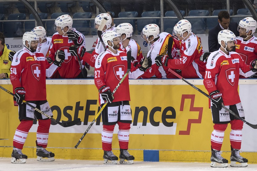 Switzerland&#039;s team cheers after scoring during a friendly ice hockey game between Switzerland and Denmark in the St. Jakob Arena in Basel, Switzerland, on Friday, April 28, 2017. (PPR/Georgios Ke ...