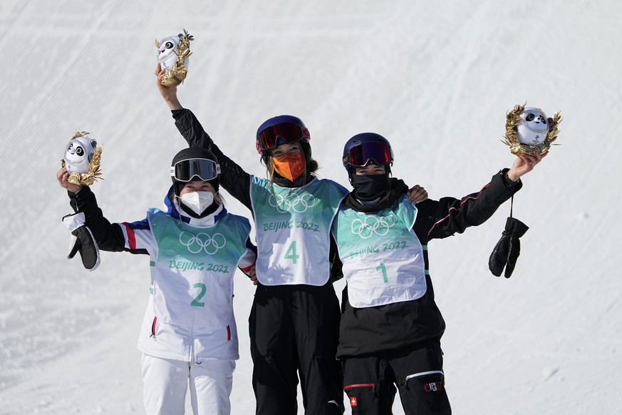 Silver medalist, from left, Tess Ledeux, of France, gold medalist Eileen Gu, of China, and bronze medalist Mathilde Gremaud of Switzerland pose for photos after the women&#039;s freestyle skiing big a ...