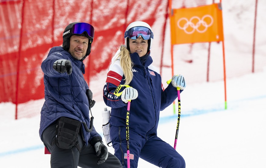 Lindsey Vonn of the United States reacts next to the coach Aksel Lund Svindal of Norway during the inspection before the women's official alpine skiing downhill training at the 2026 Olympic Winte ...