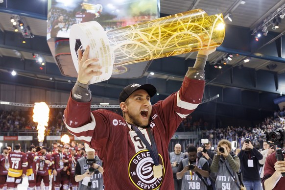 Geneve-Servette&#039;s forward Valtteri Filppula celebrates with the trophy of Swiss Champion after winning by 4:1 the seventh and final leg of the ice hockey National League Swiss Championship final ...