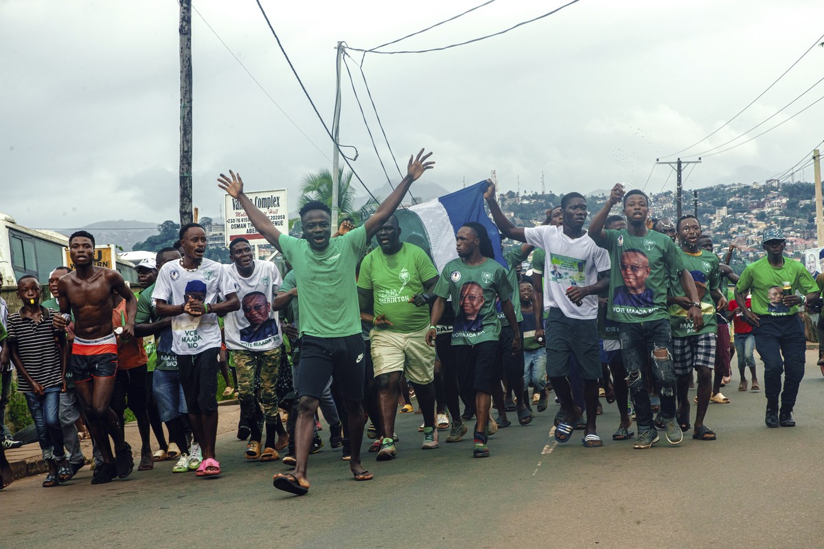 Supporters of President Julius Maada Bio celebrate in the streets of Freetown, Sierra Leone, after the electoral commission declared him the winner, Tuesday June 27, 2023. Sierra Leone's election ...