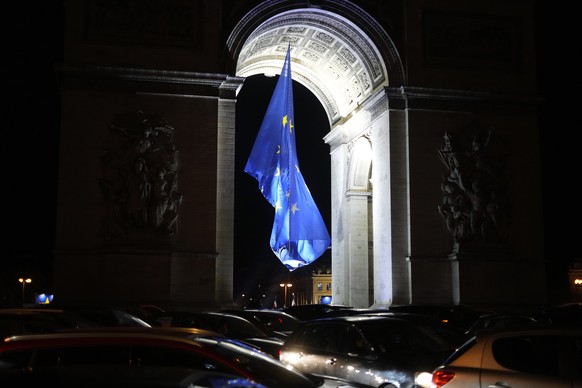 The European flag flies under the Arc de Triomphe to mark France&#039;s EU presidency in Paris, France, Saturday, Jan. 1, 2022. France takes over the rotating presidency of the European Union for the  ...