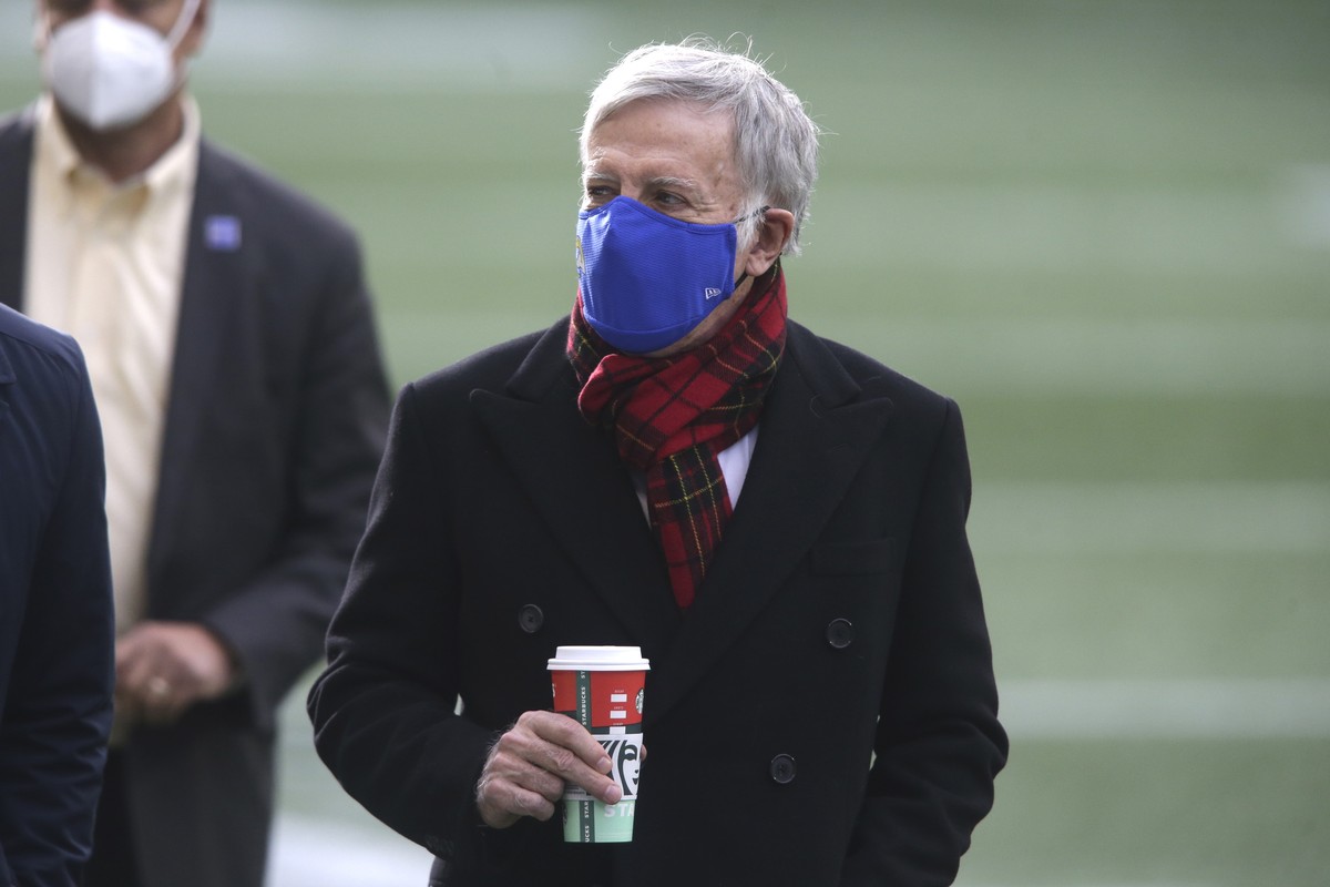 Los Angeles Rams owner Stan Kroenke walks on the field before an NFL football game against the Seattle Seahawks, Sunday, Dec. 27, 2020, in Seattle. (AP Photo/Scott Eklund)