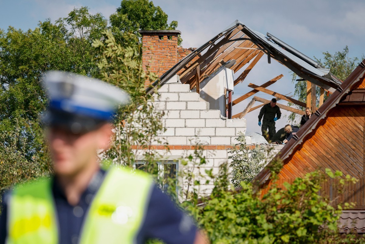 Police and army inspect damage to a house destroyed by debris from a shot down Russian drone in the village of Wyryki-Wola, eastern Poland, on September 10, 2025. NATO air defences helped counter dron ...