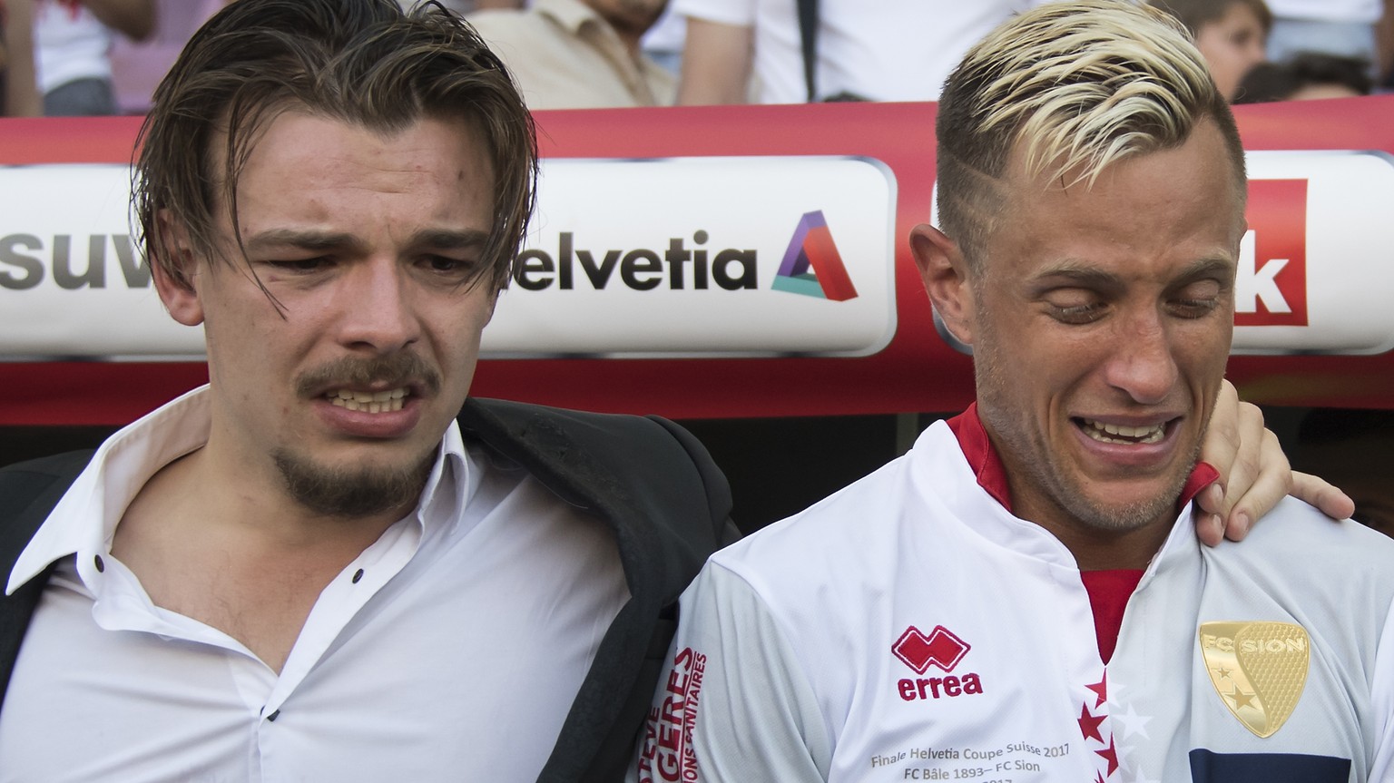 Sion&#039;s defender Reto Ziegler, right, reacts next to the FC Sion&#039;s team manager Barthelemy Constantin, left, during the the Swiss Cup final soccer match between FC Basel 1893 and FC Sion at t ...