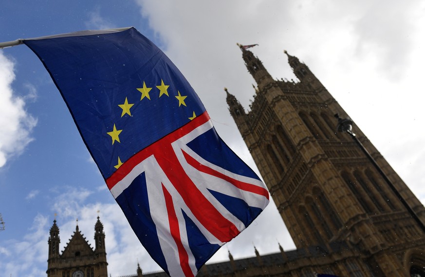 epa06566510 Pro EU protesters wave a joined EU and Union flag outside of the British Parliament in Westminster, central London, Britain, 26 February 2018. Media reports state on 26 February 2018 that  ...