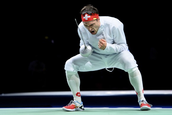 Switzerland&#039;s Max Heinzer celebrates the victory against Ukraine&#039;s Roman Svichkar during the men&#039;s epee fencing individual round of 32 competition at the 2020 Tokyo Summer Olympics at t ...