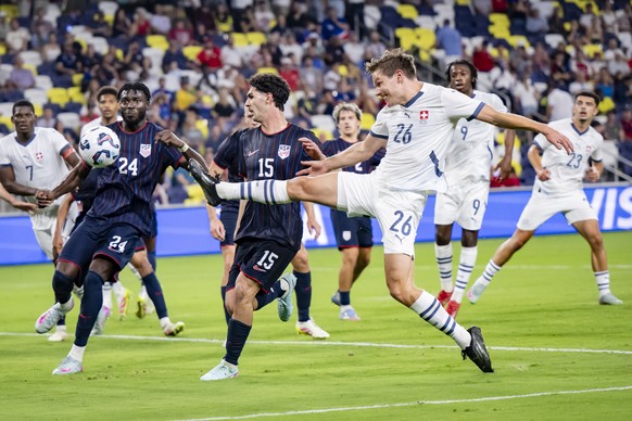 USA's Patrick Agyemang, left, fights for the ball with Switzerland's Stefan Gartenmann, right, during a Friendly soccer match between USA and Switzerland at the Geodis Park stadium, in Nashv ...
