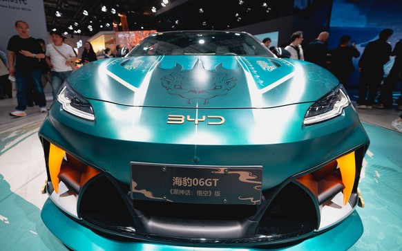 epa12054011 A BYD model 06GTcar is on display at the booth of Chinese carmaker BYD during the first public day of the Shanghai Auto show, in Shanghai, China, 25 April 2025. The 21st Shanghai Internati ...