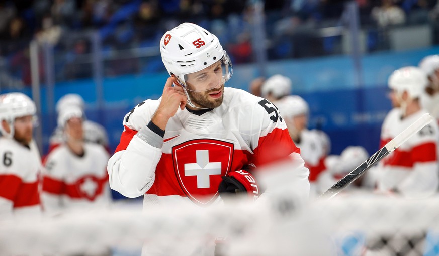 epa09740764 Romain Loeffel of Switzerland reacts after losing the Men&#039;s Ice Hockey preliminary round match between Russia and Switzerland at the Beijing 2022 Olympic Games in Beijing, China, 09 F ...