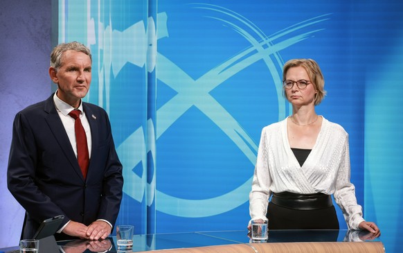 epa11578330 Top candidate of the far-right AfD (Alternative for Germany) party for regional elections in Thuringia Bjoern Hoecke (L) and the top candidate of the new left-wing populist party Sahra Wag ...