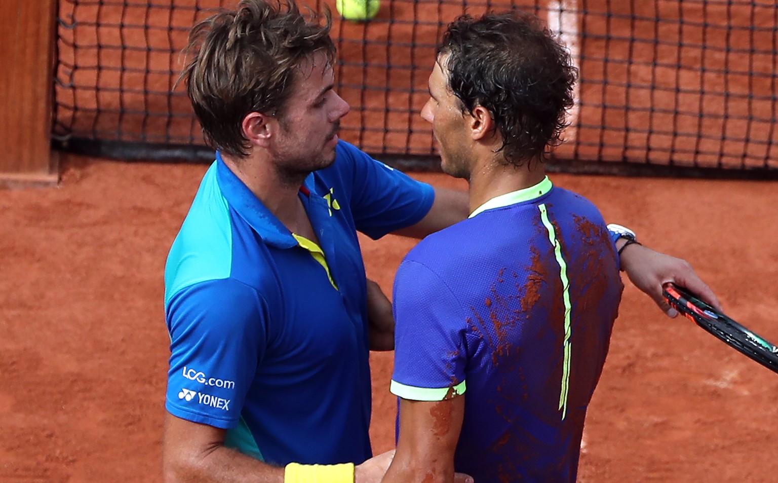 epa06022883 Rafael Nadal of Spain (R) reacts after winning the men’s singles final match against Stanislas Wawrinka of Switzerland during the French Open tennis tournament at Roland Garros in Paris, F ...