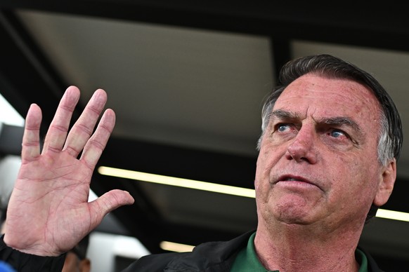 epa11987548 Brazil&#039;s former president Jair Bolsonaro (2019-2022) reacts upon his arrival at Brasilia airport, in Brasilia, Brazil, 25 March 2025. Brazil&#039;s Supreme Court began the first of th ...