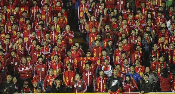 Chinese fans watch the soccer match between China and Indonesia in Xi&#039;an in northwest China&#039;s Shaanxi province Friday Nov. 15, 2013. China won by 1-0, making a step towards qualifying for th ...