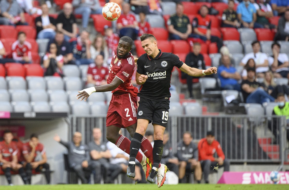 Bayern's Dayot Upamecano, left, and Eintracht's Rafael Borre vie for the ball during the Bundesliga soccer match between Bayern Munich and Eintracht Frankfurt at the Allianz Arena, Munich, G ...