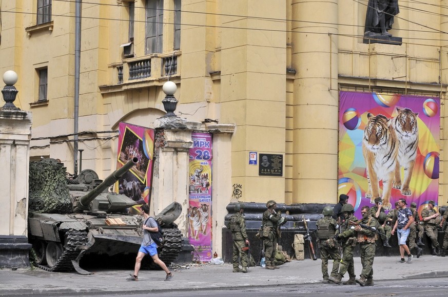 epa10709131 Servicemen from private military company (PMC) Wagner Group block a street in downtown Rostov-on-Don, southern Russia, 24 June 2023. Security and armoured vehicles were deployed after Wagn ...