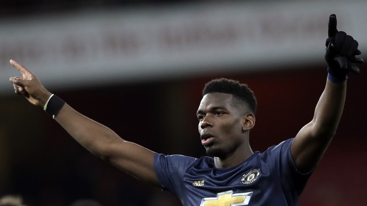 Manchester United's Paul Pogba celebrates at the end of the English FA Cup fourth round soccer match between Arsenal and Manchester United at the Emirates stadium in London, Friday, Jan. 25, 2019 ...