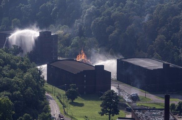 Flames and smoke rise from a bourbon warehouse fire at a Jim Beam distillery in Woodford County, Ky., Wednesday, July 3, 2019. Firefighters from four counties responded to the blaze that erupted late  ...
