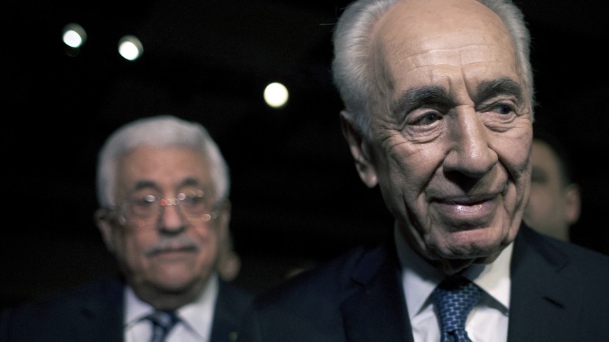 FILE - In this May 22, 2015, file photo, former Israeli President Shimon Peres, right, and Palestinian President Mahmoud Abbas arrive to attend the opening session of the World Economic Forum at the K ...