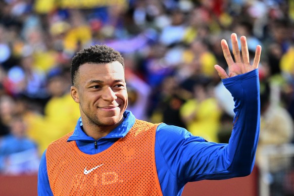 France forward Kylian Mbappé (10) waves as he warms-up during the international friendly soccer match between Colombia and France in Landover, Md., Sunday, March 29, 2026. (AP Photo/Nick Wass)
Kylian  ...