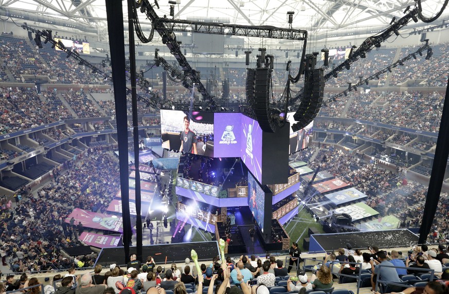 epa07746674 US Player Bugha, celebrates after winning the finals of the Solo competition at the 2019 Fortnite World Cup at Flushing Meadows Arthur Ashe stadium in Queens, New York, USA, 28 July 2019 E ...