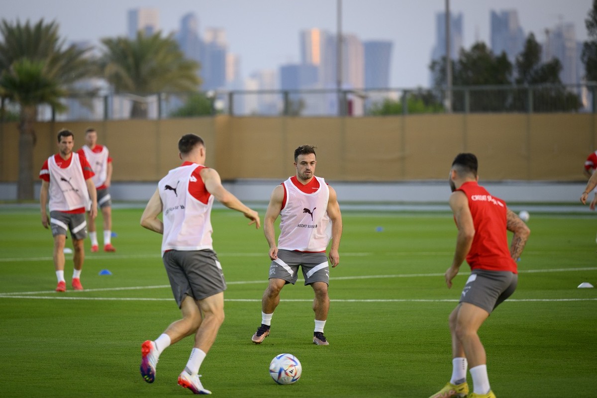 Switzerland's midfielder Xherdan Shaqiri, center, attends a open training session of Swiss national team in preparation for the FIFA World Cup Qatar 2022 at the University of Doha for Science and ...