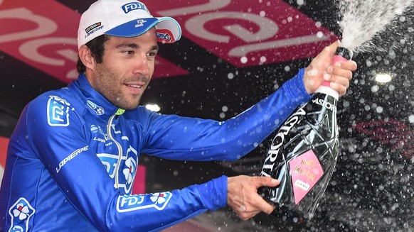 epa05993635 French rider Thibaut Pinot of FDJ team celebrates on the podium after winning the 20th stage of the 100th Giro d&#039;Italia cycling race, over 190 km from Pordenone to Asiago, Italy, 27 M ...