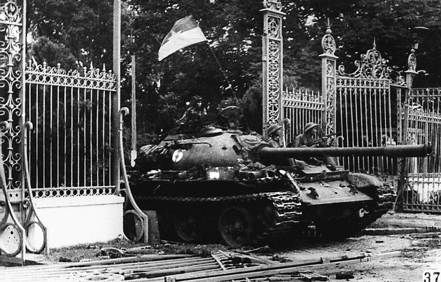 A 30 April 1975 photo shows a Northern Vietnamese communist tank driving through the main gate of the presidential palace of the US-backed South Vietnamese regime as the city fell into the hands of co ...