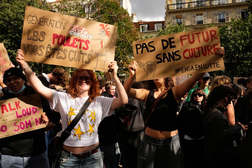 Students protest against under-resourced schools as they march towards the Place de la Bastille in Paris, Thursday, Oct. 8, 2026. Placards read:" No future without culture," and "Tasty  ...