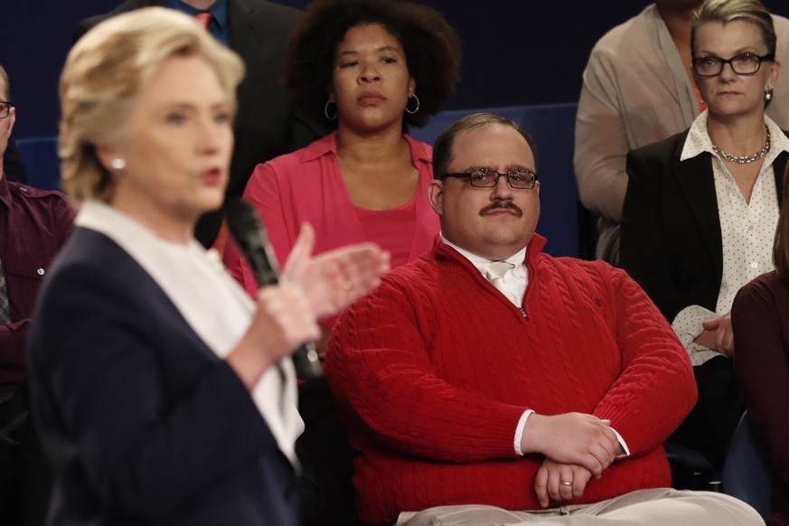 Kenneth Bone listens as Democratic presidential nominee Hillary Clinton answers a question during the second presidential debate with Republican presidential nominee Donald Trump at Washington Univers ...
