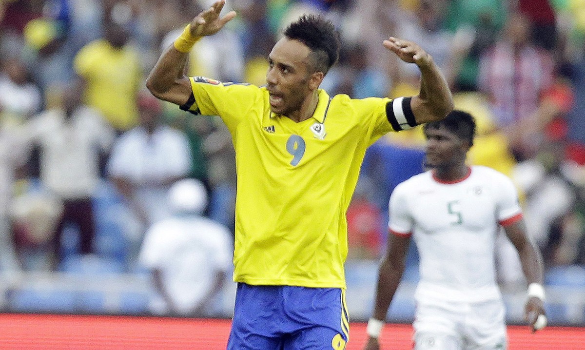 Gabon's, Pierre Emerick Aubameyang, left, celebrates after scoring, during the African Cup of Nations Group A soccer match between Gabon and Burkina Faso at the Stade de l'Amitie, in Librevi ...