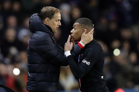 PSG&#039;s Kylian Mbappe, right, talks with PSG&#039;s head coach Thomas Tuchel during the French League One soccer match between Paris-Saint-Germain and Montpellier at the Parc des Princes stadium in ...