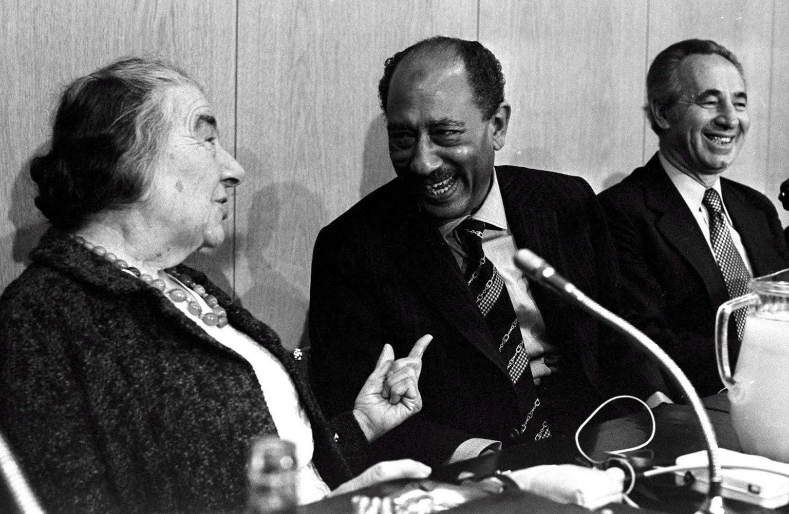 Photograph dated 21 November 1977 of Egyptian President Anwar Sadat (C) as he meets with Golda Meir (L) and Shimon Peres (R) of the Alignment faction in the Knesset, during Sadat&#039;s historic visit ...