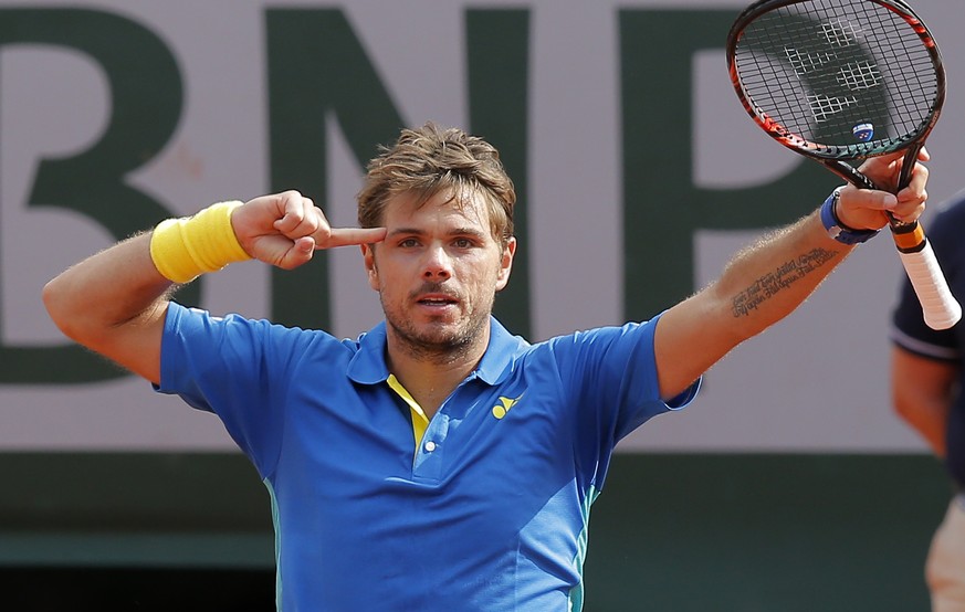 Switzerland&#039;s Stan Wawrinka celebrates winning his fourth round match of the French Open tennis tournament against France&#039;s Gael Monfils in three sets 7-5, 7-6 (9-7), 6-2, at the Roland Garr ...