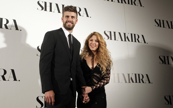 FILE - Colombian singer Shakira, right, and FC Barcelona&#039;s soccer player Gerard Pique pose to the media during the presentation of her new album &quot;Shakira&quot; in Barcelona, Spain, on March  ...