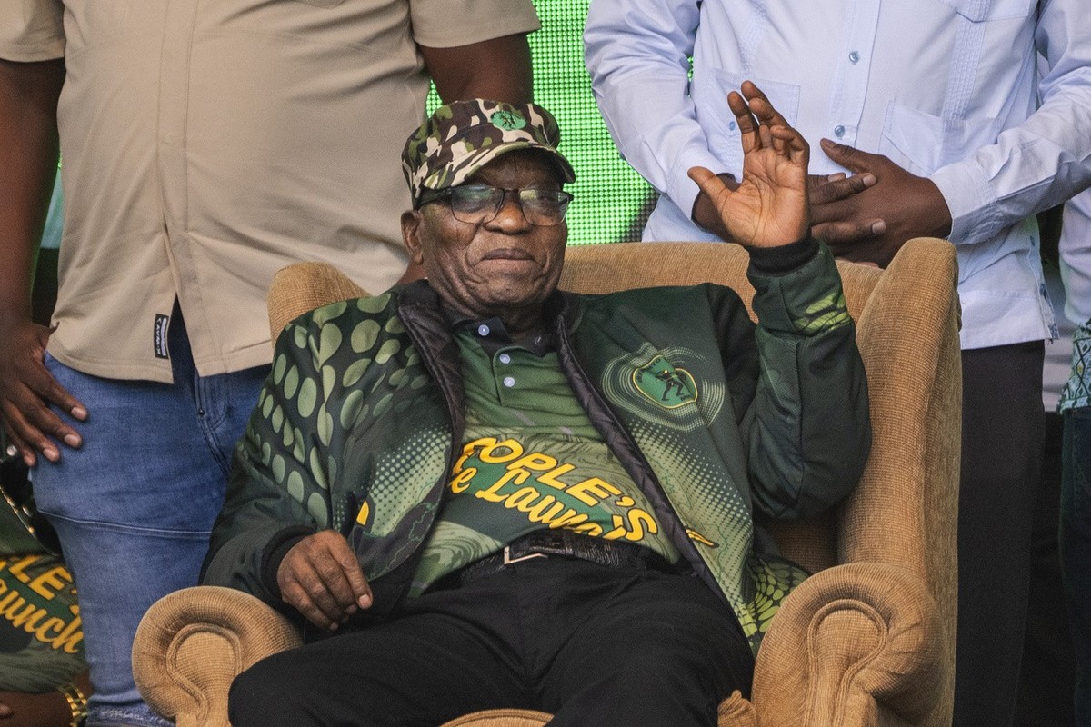 FILE - Former South African President Jacob Zuma greets supporters at Orlando stadium in Soweto, Johannesburg, South Africa, for the launch of his newly formed uMkhonto weSizwe (MK) party's manif ...