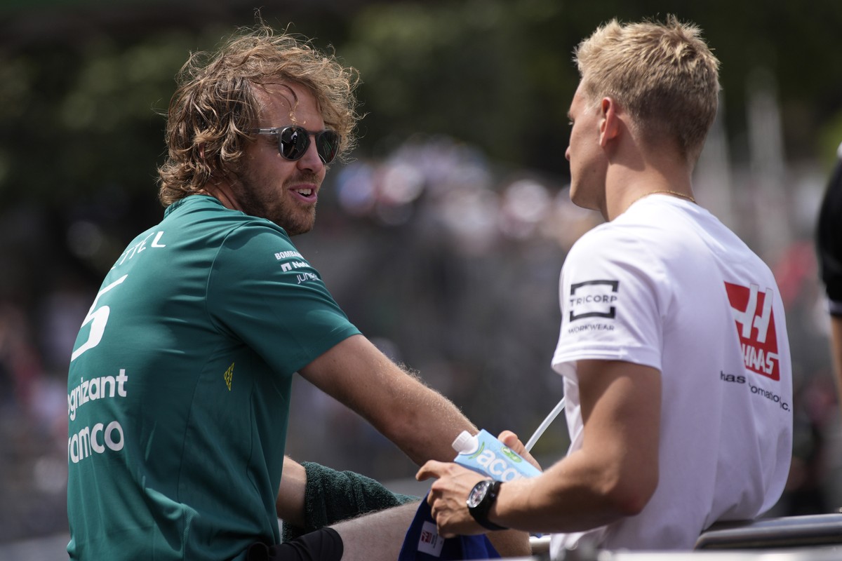 Aston Martin driver Sebastian Vettel of Germany, left, and Haas driver Kevin Magnussen of Denmark attend the driver's parade ahead the Monaco Formula One Grand Prix, at the Monaco racetrack, in M ...