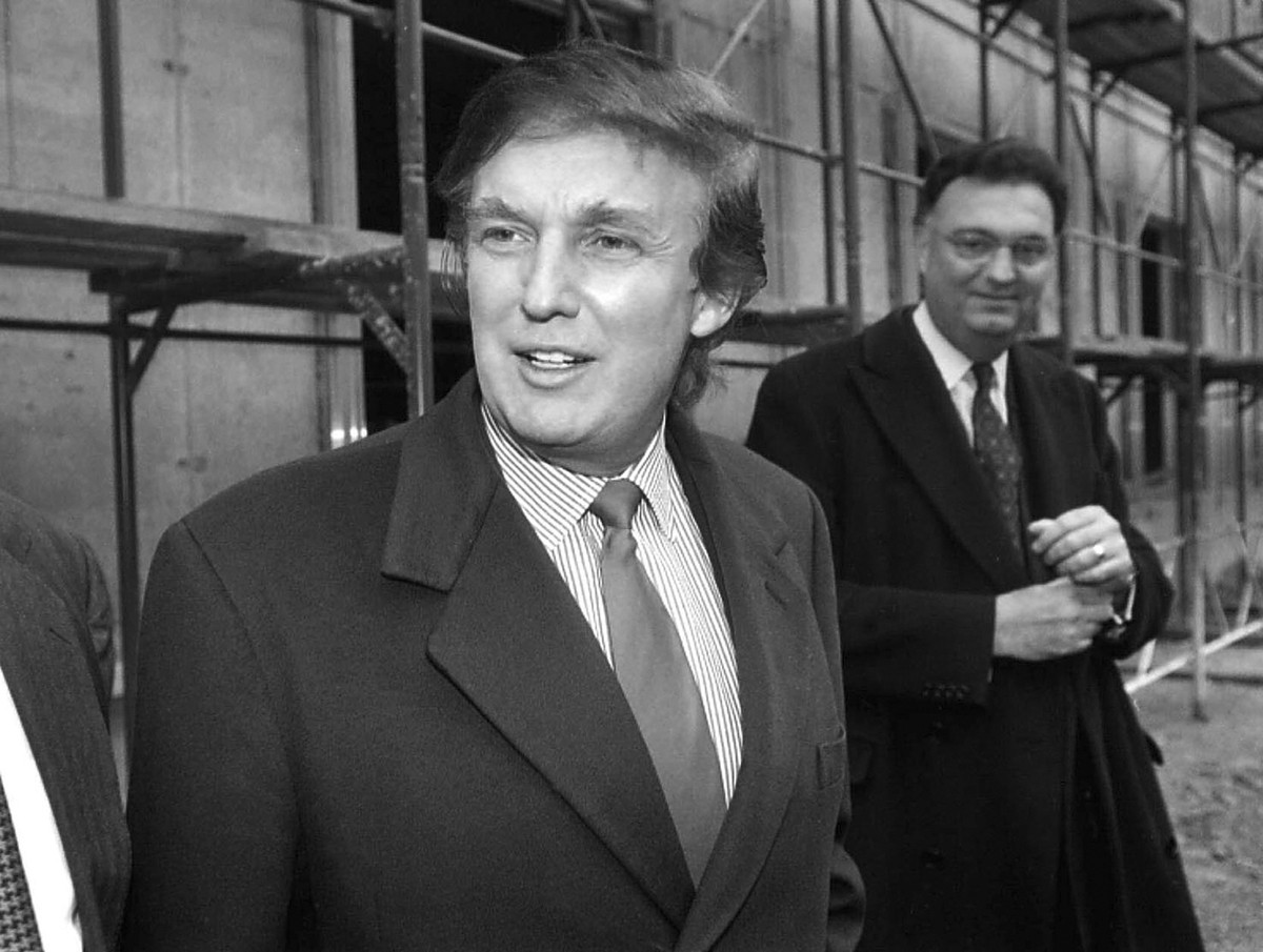 FILE - In this Nov. 5, 1996 file photo, American real estate mogul Donald Trump, left, checks out sites in Moscow, Russia, for luxury residential towers. Trump's decades-long dream of building a  ...