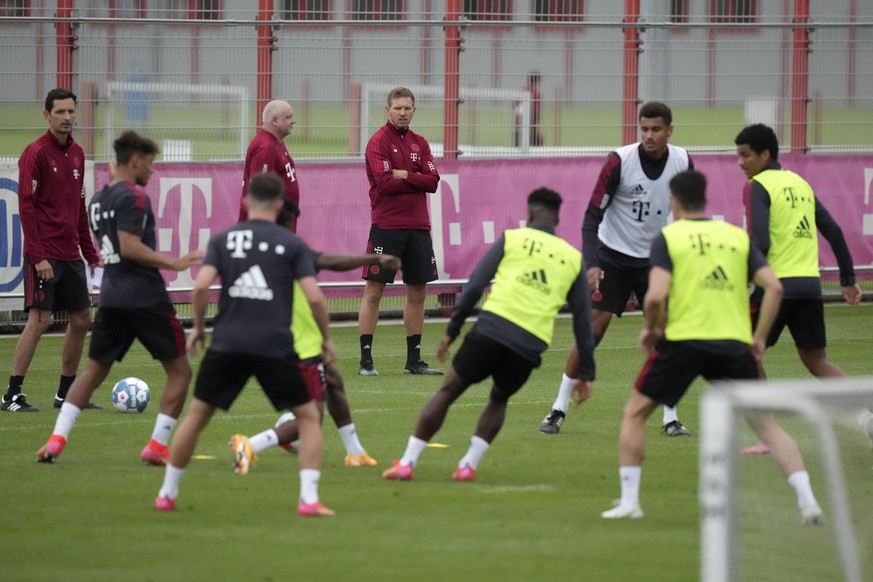 Julian Nagelsmann, new coach of German Bundesliga soccer club Bayern Munich, watches his players during a first training session in Munich, Germany, Wednesday, July 7, 2021. (AP Photo/Matthias Schrade ...