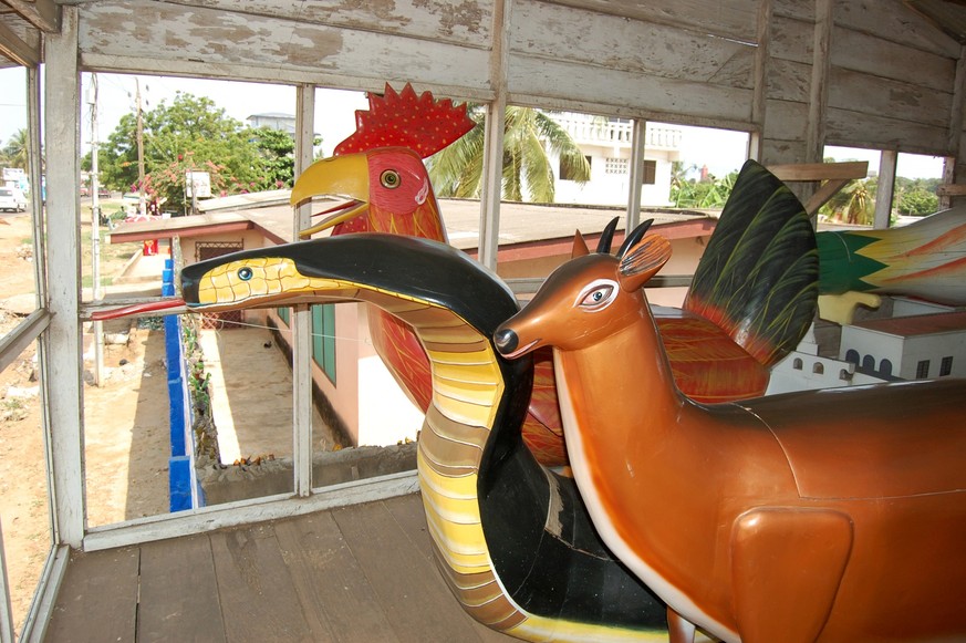 Coffin in the shape of a fish. The fantasy coffins of Teshie-Nungua. Among the Ga people, those of nobility and wealth often choose to be buried in whimsical coffins made in the form of animals and ma ...