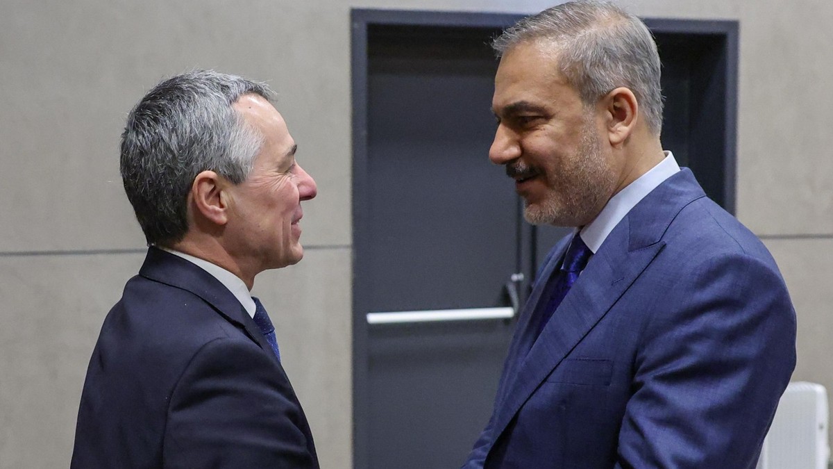 epa12026531 A handout photo made available by the Turkish Foreign Minister's Press Office shows shows Turkish Foreign Minister Hakan Fidan (R) meeting with Swiss Foreign Minister Ignazio Cassis,  ...