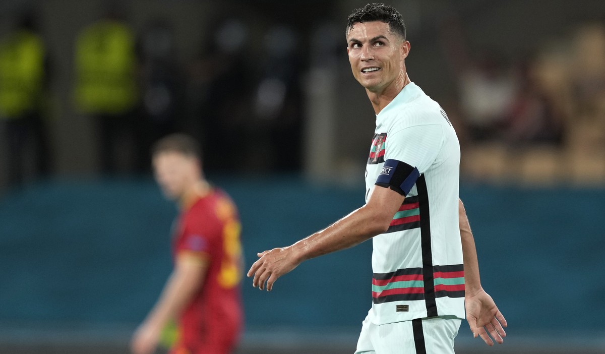 epa09306872 Portugal's player Cristiano Ronaldo reacts at the end of the UEFA EURO 2020 round of 16 soccer match between Belgium and Portugal held at La Cartuja Sevilla stadium, in Seville, Spain ...